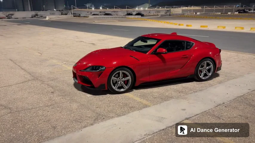 Generated red two-door coupe with silver wheels in the reference parking lot